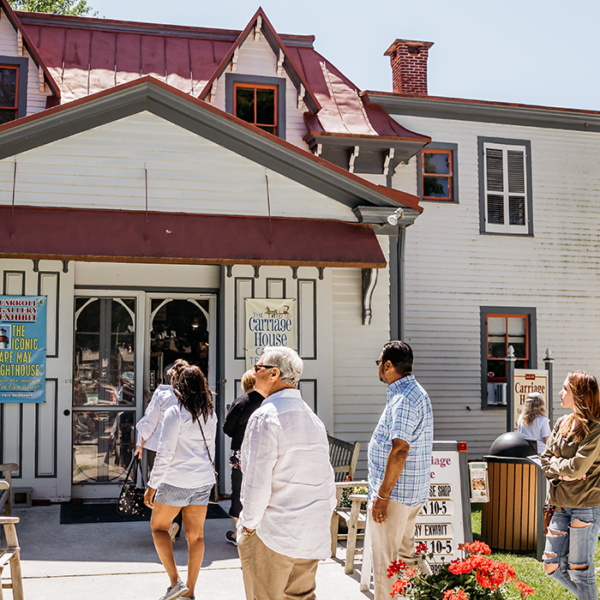 Carriage House Museum Shop 1500×700 group of tour goers walking into the Carriage House museum shop on the grounds of the emlen physick estate