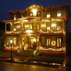 Bedford inn decorated for christmas at night with lights lit