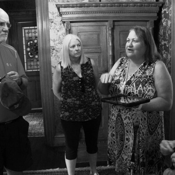 Voices From Beyond Tour 23 (45) black and white photo of people on tour in a victorian house